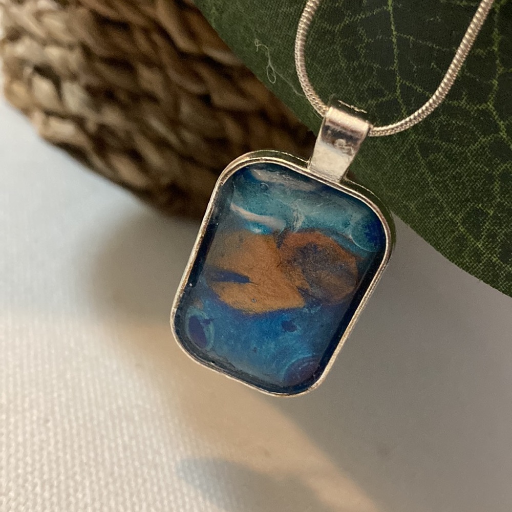 Handmade, silver toned necklace with large rectangular pendant